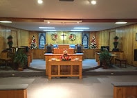 Church sanctuary interior with cross and altar